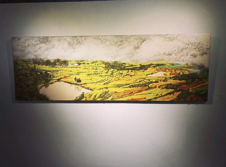 A picture of the painting of countryside with a lot of yellow, green colours.